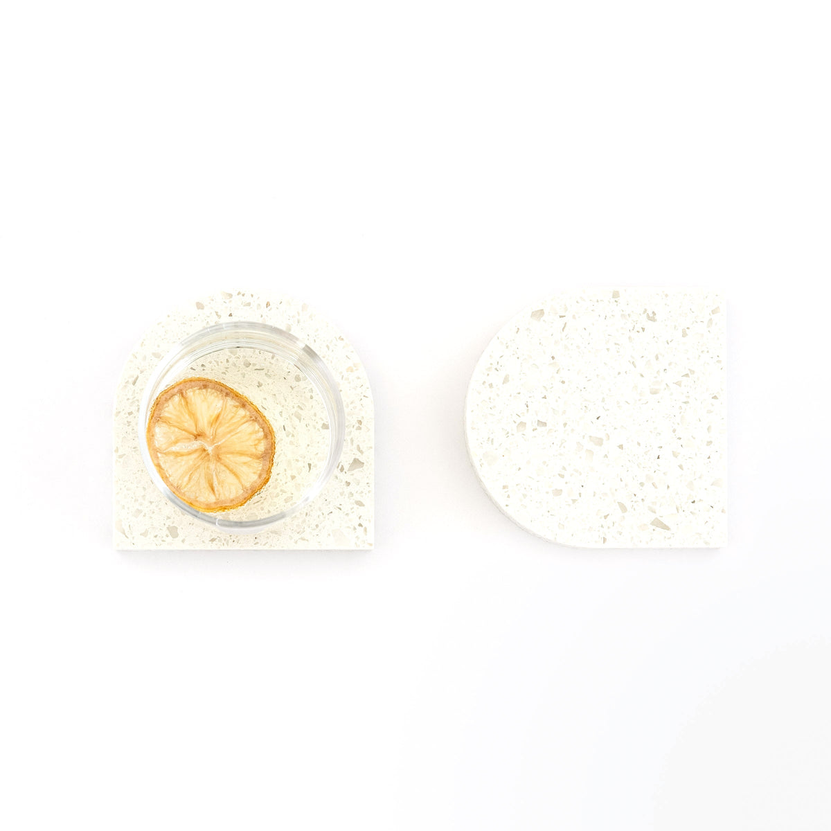 Quartz Arch Coaster™ Set 2 Piece in Nougat™. Quartz white stone coasters in an arch shape. These white quartz coasters are specked with decorative quartz with a cork backing. White marble coasters in appearance however quartz has greater scratch resistance and is lower maintenance. caesarstone quartz  