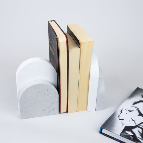 Quartz Bookend Set is 4cm thick. Styled with books. Available in Georgian Bluffs partnered with Organic White by Caesarstone a cloudy light grey, with delicate dashes of soft charcoal that disappear and resurface, meets a clean white surface with subtly blended undertones, reflecting a natural appearance that is effortlessly chic. The perfect addition to your home decor, similar to marble bookends.