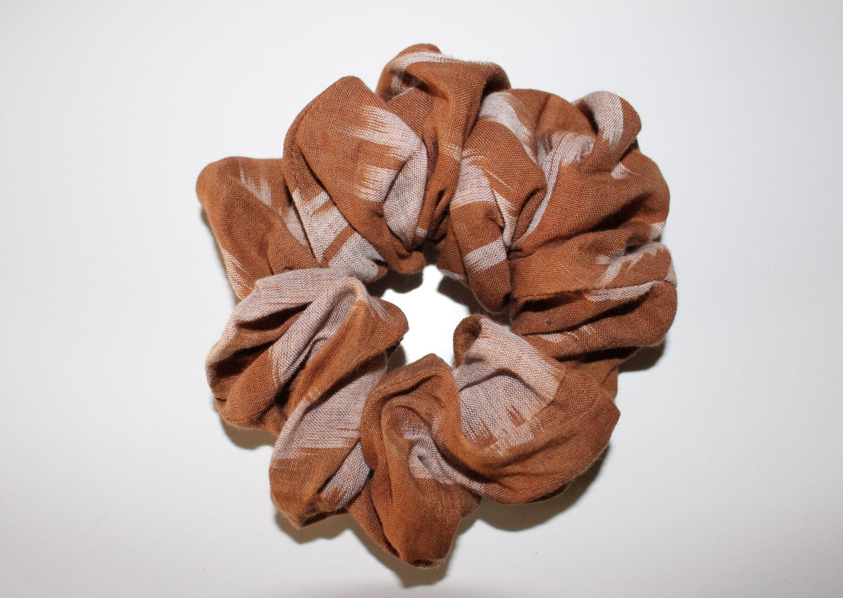 Brown Ikat Print Zero-Waste Scrunchie. Made from fabric off-cuts of our sustainably sourced hemp and organic cotton  handloom fabrics. Made in Australia by our partner charity The Social Studio. 