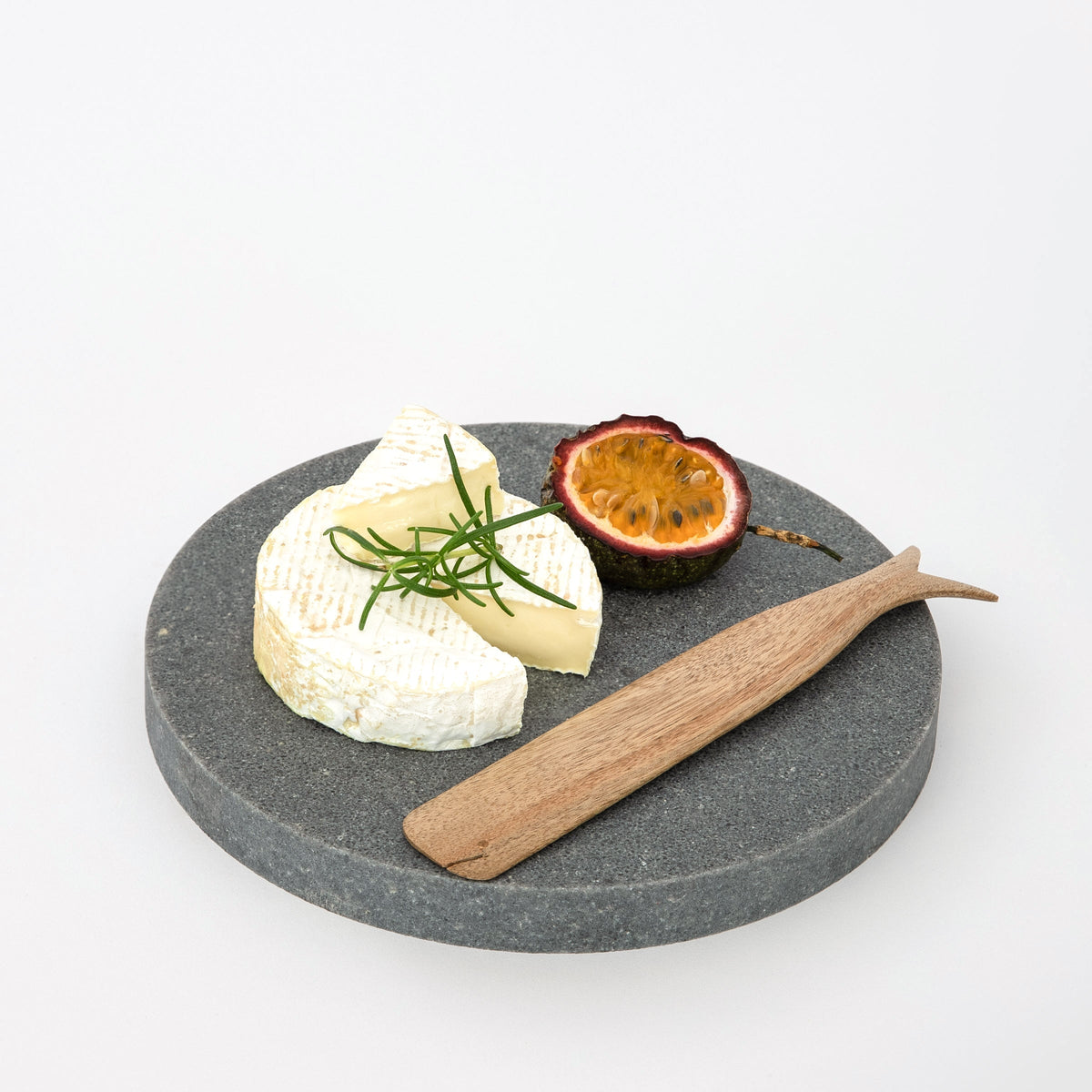 Quartz round and small serving platter in Rugged Concrete by Aureliia Collection. A round marble tray in appearance, the Small Quartz Round Serving Platter is more durable than marble and makes the perfect dessert platter, small cheese board or decorative tray. An excellent home decor gift for someone who has it all.